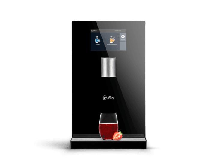 Wasserspender von Welltec mit befülltem Glas